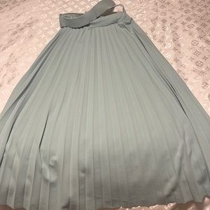Never worn before. MIDI pleated mint green skirt with belt attached.